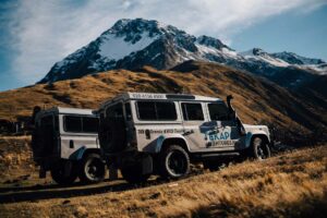 Tekapo Adventures Mackenzie Country 4WD Tour Rezdy Trip Module Image - 2 4WD's with mountains in background