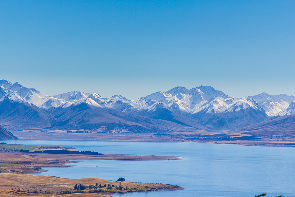 Views from the Mt John Summit - snow capped mountains and Lake Tekapo
